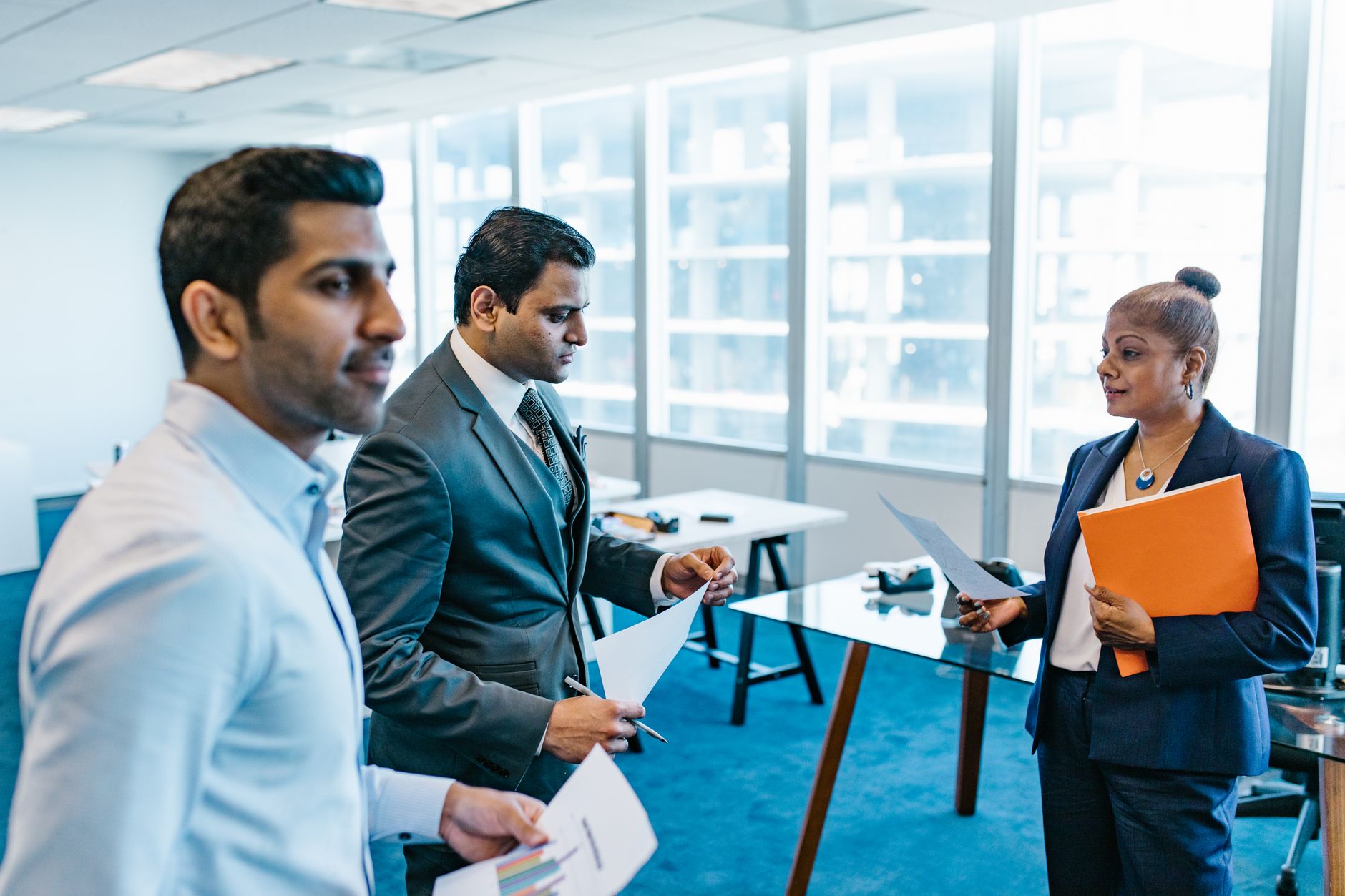 Working session between company leaders reviewing a business process