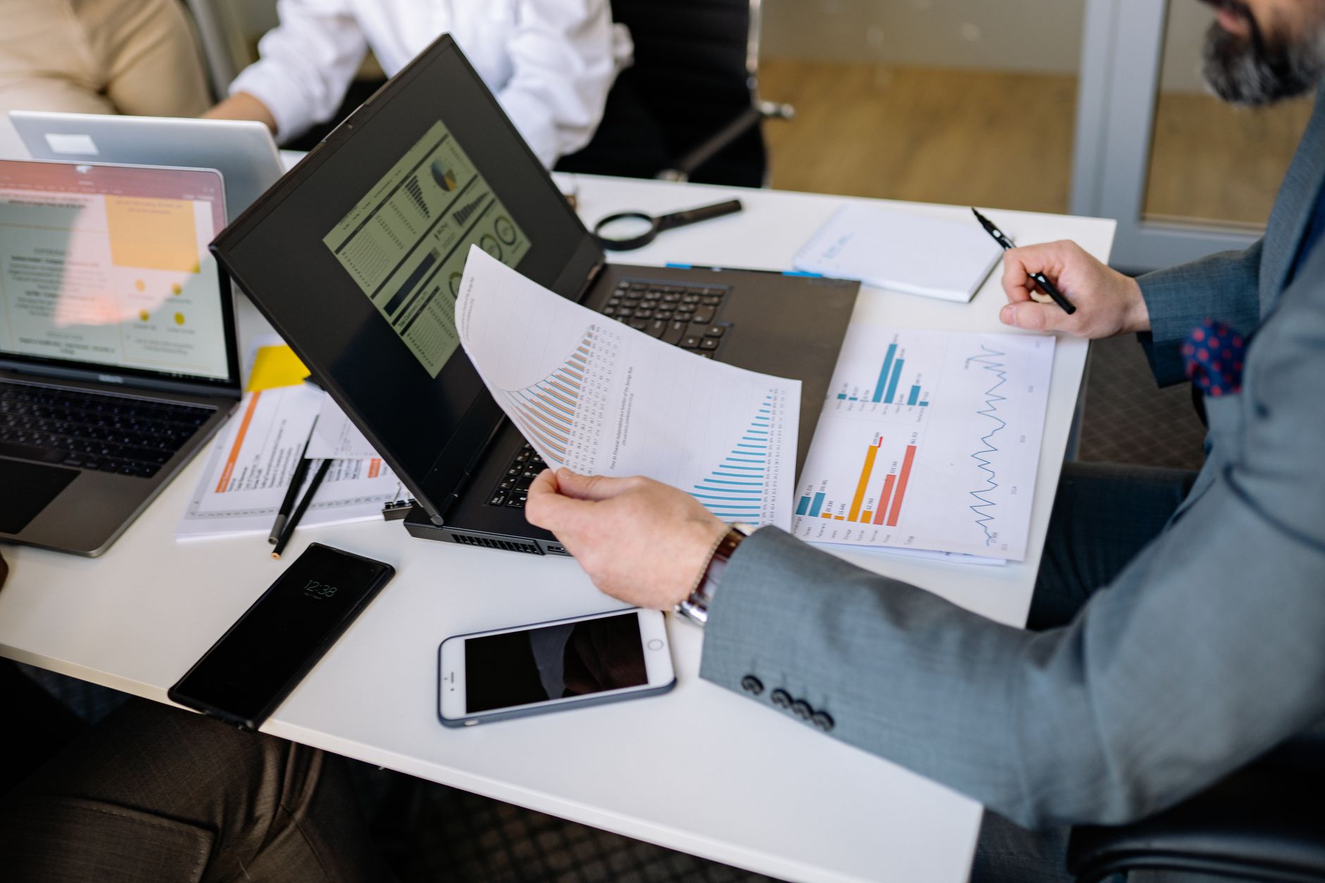 Team handling client requests and sales documents at the office